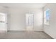 Bedroom with doorway leading to ensuite bathroom with glass-door shower and natural light at 2438 Pearl Cider Street, Orlando, FL 32824