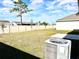 Spacious backyard with grassy area and AC unit at 245 Lawson Ave, Haines City, FL 33844