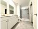 Bathroom boasts double sinks and a walk-in shower at 245 Lawson Ave, Haines City, FL 33844