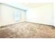 Spacious bedroom with neutral carpet and window with blinds at 245 Lawson Ave, Haines City, FL 33844