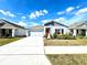 One-story home with gray siding, red door, and landscaped yard at 245 Lawson Ave, Haines City, FL 33844