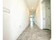 Bright hallway with tile flooring and neutral walls at 245 Lawson Ave, Haines City, FL 33844