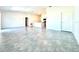 Open living room with gray tile floors and kitchen island view at 245 Lawson Ave, Haines City, FL 33844