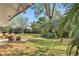 Private backyard oasis with patio, outdoor shower, and tropical landscaping at 2564 Sheffield Ave, Orlando, FL 32806