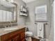 Bathroom with granite countertop, large mirror, and shower at 2564 Sheffield Ave, Orlando, FL 32806