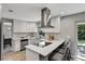 Modern kitchen with white shaker cabinets and stainless steel appliances at 2564 Sheffield Ave, Orlando, FL 32806