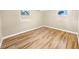 Well-lit bedroom showcasing hardwood floors at 2569 Belmont Ave, New Smyrna Beach, FL 32168