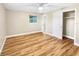 Spacious bedroom with wood-look floors and ceiling fan at 2569 Belmont Ave, New Smyrna Beach, FL 32168