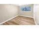 Simple bedroom with light walls and wood-look flooring at 2569 Belmont Ave, New Smyrna Beach, FL 32168