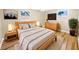 Light-filled main bedroom with hardwood floors and wooden furniture at 2569 Belmont Ave, New Smyrna Beach, FL 32168