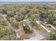 Aerial view of a house and surrounding neighborhood, showcasing the property's location and lot size at 25753 Vero St, Sorrento, FL 32776