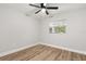 Bedroom with wood-look floors and ceiling fan at 25753 Vero St, Sorrento, FL 32776