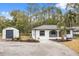 Newly renovated home with a storage shed and landscaped yard at 25753 Vero St, Sorrento, FL 32776