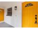 Inviting house entrance with bright yellow door at 25753 Vero St, Sorrento, FL 32776