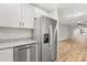 Stainless steel appliances and granite countertops in this kitchen at 25753 Vero St, Sorrento, FL 32776