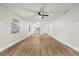 Hardwood floors and ceiling fan in this living room at 25753 Vero St, Sorrento, FL 32776