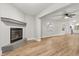 Open living room with hardwood floors and a view into the kitchen at 25753 Vero St, Sorrento, FL 32776