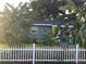 Gray house with white picket fence and tropical landscaping at 28 S Hastings St, Orlando, FL 32835