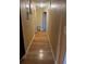 Long hallway with light walls and wood flooring at 28 S Hastings St, Orlando, FL 32835