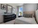 Simple bedroom with black and white decor and large mirror at 2969 Moulin Rd, Davenport, FL 33837