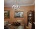 Dining room with chandelier and decorative mirror at 3030 Clubview Dr # Ge, Orlando, FL 32822