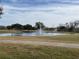 Serene pond with fountain in a lush green landscape at 3030 Clubview Dr # Ge, Orlando, FL 32822