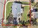 Aerial view showing house, large backyard, and surrounding neighborhood at 305 S Halifax Dr, Ormond Beach, FL 32176