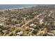 Aerial perspective of house near beach and coastline at 305 S Halifax Dr, Ormond Beach, FL 32176