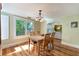 Dining room features hardwood floors and white shutters at 305 S Halifax Dr, Ormond Beach, FL 32176