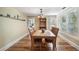 Dining room with hardwood floors and view into kitchen at 305 S Halifax Dr, Ormond Beach, FL 32176