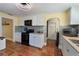 White kitchen with stainless steel appliances and mosaic backsplash at 305 S Halifax Dr, Ormond Beach, FL 32176