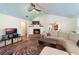 Living room with a fireplace, vaulted ceiling and hardwood floors at 305 S Halifax Dr, Ormond Beach, FL 32176