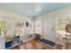 Bright sunroom with hardwood floors and white shutters at 305 S Halifax Dr, Ormond Beach, FL 32176