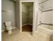 Bathroom with tub, toilet, and walk-in closet at 3250 Corona Village Way # 302, Orlando, FL 32835