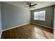 Bright bedroom with wood-look floors and large window at 3250 Corona Village Way # 302, Orlando, FL 32835