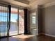 Bright bedroom with access to a private balcony and lake view at 3250 Corona Village Way # 302, Orlando, FL 32835
