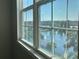 Stunning lake view from large window, featuring fountain at 3250 Corona Village Way # 302, Orlando, FL 32835
