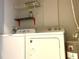 Laundry room with washer, dryer, and shelving at 3250 Corona Village Way # 302, Orlando, FL 32835