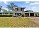 Charming two-story home with a well-manicured lawn and attached two car garage at 3334 N Westmoreland Dr, Orlando, FL 32804