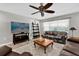 Bright living room with ceiling fan, flat screen TV and tile flooring at 3334 N Westmoreland Dr, Orlando, FL 32804