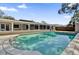 The crystal clear water of the pool is framed by a view of the screened in patio at 3334 N Westmoreland Dr, Orlando, FL 32804