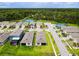 Aerial view of community with homes, tennis courts, and conservation at 367 Caryota Ct, New Smyrna Beach, FL 32168