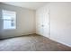 Spacious bedroom with neutral carpeting and double door closet at 367 Caryota Ct, New Smyrna Beach, FL 32168