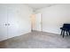 Bright bedroom with plush carpeting, double door closet, and neutral walls at 367 Caryota Ct, New Smyrna Beach, FL 32168