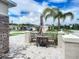 Charming front patio with table and chairs, perfect for relaxing at 367 Caryota Ct, New Smyrna Beach, FL 32168