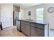 Granite countertop kitchen island and stainless steel refrigerator at 367 Caryota Ct, New Smyrna Beach, FL 32168