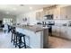 Modern kitchen with stainless steel appliances and an island at 367 Caryota Ct, New Smyrna Beach, FL 32168