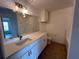 Modern bathroom with white cabinets and a bathtub at 3724 Castle Pines Ln # 4237, Orlando, FL 32839