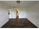 Spacious bedroom with dark laminate flooring and access to bathroom at 3724 Castle Pines Ln # 4237, Orlando, FL 32839