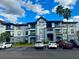 Apartment building with parking and landscaping at 3724 Castle Pines Ln # 4237, Orlando, FL 32839